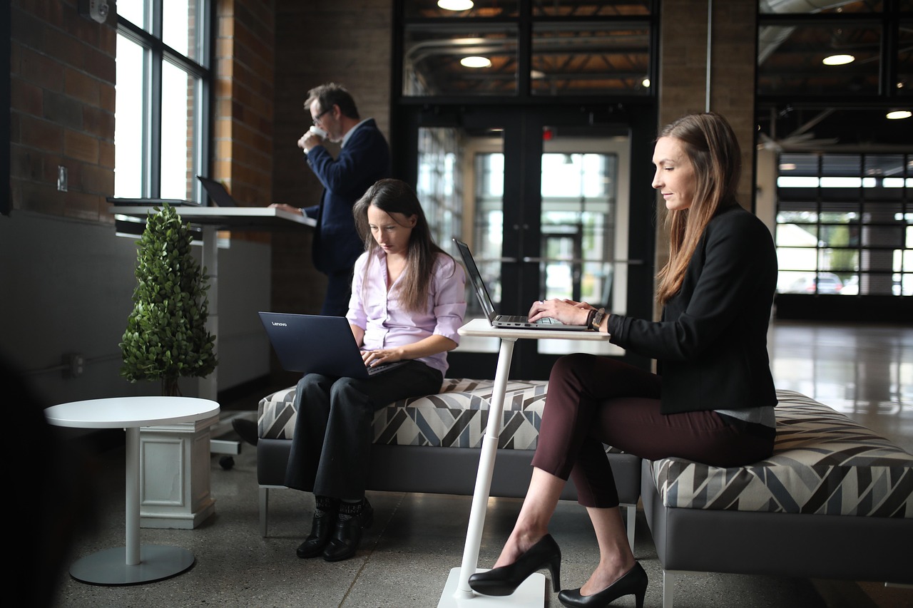 Professional office team collaborating on work projects in modern business environment